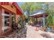 Extensive backyard with brick-paved surface and multiple sitting areas and unique decor at 1702 W Monterosa W St, Phoenix, AZ 85015