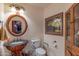 A powder room featuring a vessel sink, unique vanity, and elegant decor, offering a touch of sophistication at 1702 W Monterosa W St, Phoenix, AZ 85015