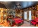 A bedroom suite featuring a full sitting area, ceiling fan, patio exit, and warm, elegant decor at 1702 W Monterosa W St, Phoenix, AZ 85015