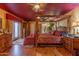 A luxurious Primary suite with a four-poster bed, hardwood floors, and access to an outdoor patio at 1702 W Monterosa W St, Phoenix, AZ 85015