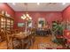 Formal dining room featuring a wooden table, elegant chandelier, and built-in china cabinet at 1702 W Monterosa W St, Phoenix, AZ 85015
