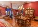 Grand dining room with an ornate chandelier, hardwood flooring, and an adjacent living area at 1702 W Monterosa W St, Phoenix, AZ 85015