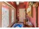 Inviting entryway with decorative glass doors, rich color palette, and elegant details at 1702 W Monterosa W St, Phoenix, AZ 85015