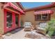 Cozy front porch with red awnings, wicker furniture, and a welcoming ambiance at 1702 W Monterosa W St, Phoenix, AZ 85015