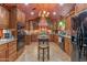 Custom kitchen with dark wood cabinetry, modern appliances, and a unique ceiling design at 1702 W Monterosa W St, Phoenix, AZ 85015