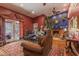 Cozy living room with a stone fireplace, hardwood floors, and comfortable seating at 1702 W Monterosa W St, Phoenix, AZ 85015
