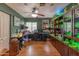 A home office featuring wood floors, custom shelving, and ample workspace for productivity and organization at 1702 W Monterosa W St, Phoenix, AZ 85015