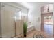Bathroom featuring a glass enclosed shower and large tub at 17844 W Caribbean Ln, Surprise, AZ 85388