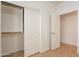 Bright bedroom featuring closet with sliding doors, and an additional door at 17844 W Caribbean Ln, Surprise, AZ 85388