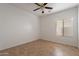 Bedroom featuring a ceiling fan and a window for natural light at 17844 W Caribbean Ln, Surprise, AZ 85388