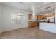 Spacious kitchen and dining area with stainless steel appliances and granite countertops at 17844 W Caribbean Ln, Surprise, AZ 85388