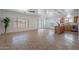 Open-concept living area featuring tile floors and lots of natural light at 17844 W Caribbean Ln, Surprise, AZ 85388
