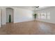 Large living area with a ceiling fan and neutral paint at 17844 W Caribbean Ln, Surprise, AZ 85388