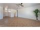 Large living area featuring a ceiling fan and neutral paint at 17844 W Caribbean Ln, Surprise, AZ 85388
