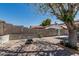 Private backyard featuring a brick patio, block wall and mature shade tree at 18233 N 55Th Dr, Glendale, AZ 85308