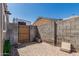 Fenced backyard with brick-paved area and access gate for added privacy at 18233 N 55Th Dr, Glendale, AZ 85308