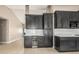 The kitchen boasts ample cabinet space and includes a built-in wine cooler for added convenience at 18233 N 55Th Dr, Glendale, AZ 85308