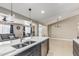 This kitchen boasts a large island, stainless steel appliances, and an open layout for easy entertaining at 18233 N 55Th Dr, Glendale, AZ 85308