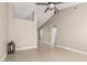 Open living room with tile flooring, neutral walls, and a view of the upper level and hallway at 18233 N 55Th Dr, Glendale, AZ 85308