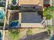 Aerial view of the property, showcasing a swimming pool and neighborhood homes at 1834 W Nighthawk Way, Phoenix, AZ 85045