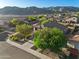 Aerial view of the property, showcasing front yard and neighborhood homes with mountain views at 1834 W Nighthawk Way, Phoenix, AZ 85045