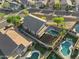 Aerial view of the property, showcasing swimming pool and neighborhood homes with green lawns at 1834 W Nighthawk Way, Phoenix, AZ 85045