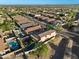 Aerial view of the property, showcasing swimming pool and neighborhood homes, desert landscaping at 1834 W Nighthawk Way, Phoenix, AZ 85045