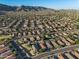 An aerial view captures the well-planned community with mountain views and lush landscaping throughout the neighborhood at 1834 W Nighthawk Way, Phoenix, AZ 85045