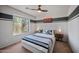 Cozy bedroom with carpet, ceiling fan, and windows with view at 1834 W Nighthawk Way, Phoenix, AZ 85045