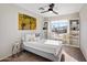 Bright bedroom with a ceiling fan, natural light, and window with neighborhood views at 1834 W Nighthawk Way, Phoenix, AZ 85045