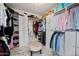 Spacious walk-in closet features custom shelves, cabinets, and ample storage space at 1834 W Nighthawk Way, Phoenix, AZ 85045