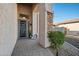 Inviting front entryway with a decorative security door and stone accents at 1834 W Nighthawk Way, Phoenix, AZ 85045