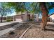 Charming two-story home boasts a stucco exterior, stone accents, and a well-manicured front yard at 1834 W Nighthawk Way, Phoenix, AZ 85045