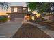 Charming two-story home boasts a stucco exterior, stone accents, and a well-manicured front yard at 1834 W Nighthawk Way, Phoenix, AZ 85045