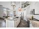 Open kitchen with a large island, stainless steel appliances, and views of the living space at 1834 W Nighthawk Way, Phoenix, AZ 85045