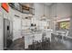 Beautiful kitchen featuring a large center island, white cabinetry, and modern appliances at 1834 W Nighthawk Way, Phoenix, AZ 85045