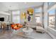 Open-concept living area with a cozy sectional sofa and bright, airy windows at 1834 W Nighthawk Way, Phoenix, AZ 85045