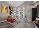 Bright living room featuring high ceilings, large windows, and modern artwork at 1834 W Nighthawk Way, Phoenix, AZ 85045