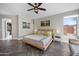 Comfortable primary bedroom with wood floors, neutral walls, and a large window showcasing mountain views at 1834 W Nighthawk Way, Phoenix, AZ 85045