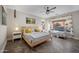 Relaxing primary bedroom featuring wood floors and large windows overlooking the backyard at 1834 W Nighthawk Way, Phoenix, AZ 85045