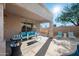 The covered patio offers a comfortable seating area, perfect for relaxing by the pool and enjoying outdoor living at 1834 W Nighthawk Way, Phoenix, AZ 85045