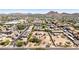 Expansive aerial view of a residential community nestled among scenic mountains in a vibrant neighborhood setting at 1851 E Campo Bello Dr, Phoenix, AZ 85022