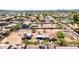 Aerial view of the property featuring mature trees, structures, neighborhood setting with nearby amenities at 1851 E Campo Bello Dr, Phoenix, AZ 85022