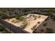 Wide lot featuring mature trees and gravel areas, complete with gated access and street frontage at 1851 E Campo Bello Dr, Phoenix, AZ 85022