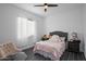 Cozy bedroom with natural light, neutral tones, and space for relaxation at 18544 W Devonshire Ave, Goodyear, AZ 85395