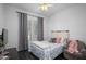 Comfortable bedroom featuring a ceiling fan and great natural light at 18544 W Devonshire Ave, Goodyear, AZ 85395
