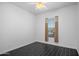 Minimalist bedroom with a large window and neutral decor for a clean and modern aesthetic at 18544 W Devonshire Ave, Goodyear, AZ 85395