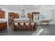 Modern kitchen featuring an island with granite countertops, stainless steel appliances, and pendant lighting at 18544 W Devonshire Ave, Goodyear, AZ 85395