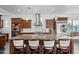 Modern kitchen featuring an island with granite countertops, stainless steel appliances, and pendant lighting at 18544 W Devonshire Ave, Goodyear, AZ 85395