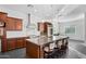 Bright kitchen featuring an island with granite countertops, stainless steel appliances, and pendant lighting at 18544 W Devonshire Ave, Goodyear, AZ 85395